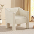 The Margot sculptural barrel chair in cream chenille, styled in a warm living room corner