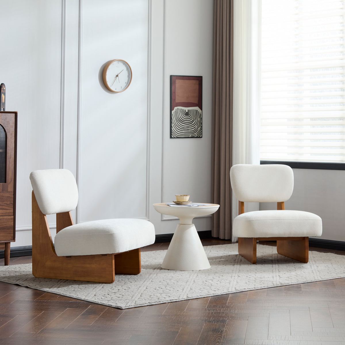 The Elodie low slipper chairs, set of 2, cream boucle on natural wood bases, styled in a sunlit living room